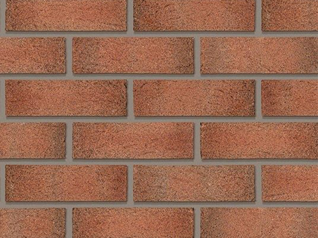 Close up of a wall of Sandwell Red Multi bricks