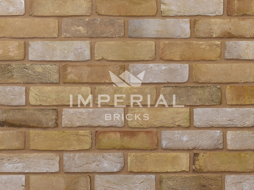 Close up of a wall of Reclamation Buff Handmade bricks