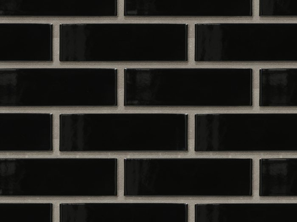 Close up of a wall of Berlin Black Glazed bricks