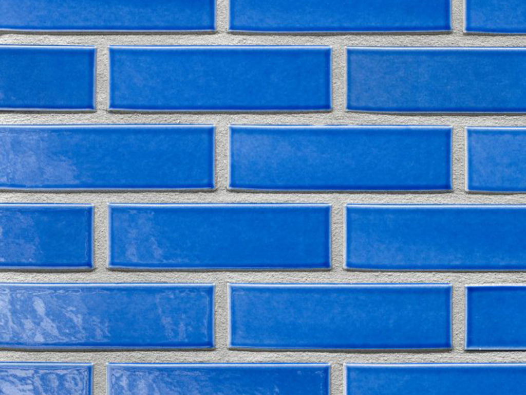 Close up of a wall of Panama Blue Glazed bricks