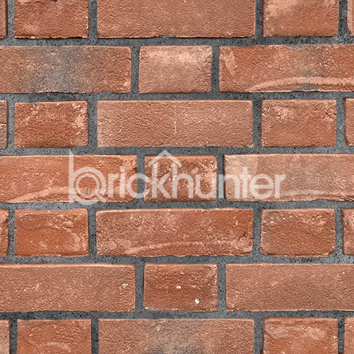 Close up of a wall of Orange Multi Gilt Stock bricks