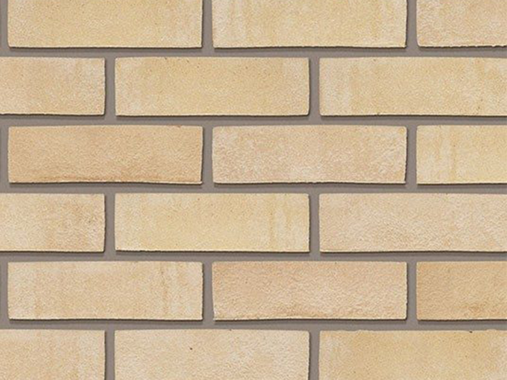 Close up of a wall of Woodstock Buff bricks