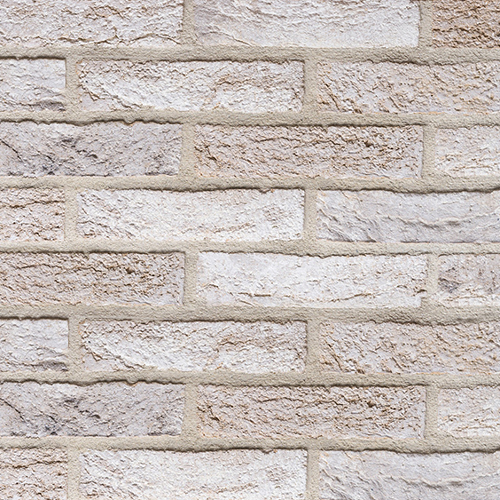 Close up of a wall of Crema bricks