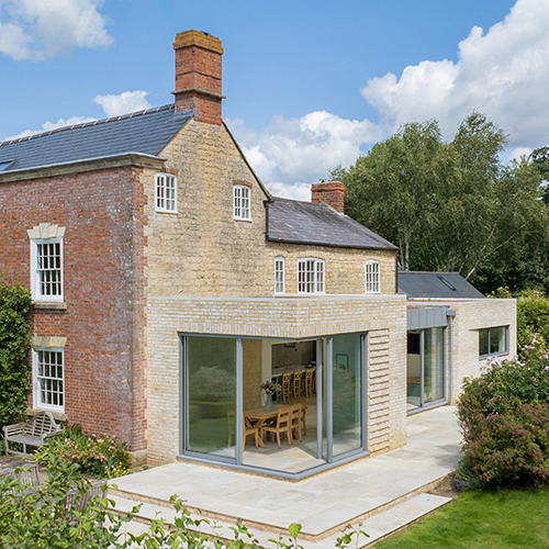 Rear view of a residential property with an extension built using Marziale bricks