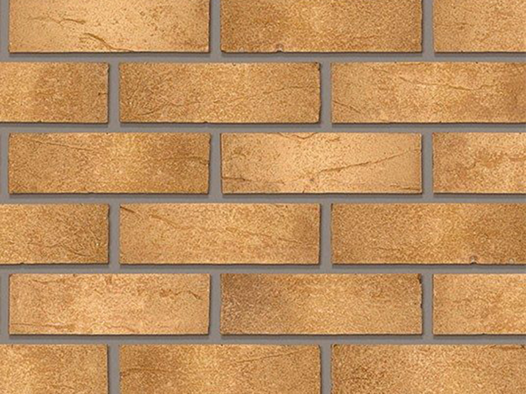 Close up of a wall of Warm Golden Buff bricks