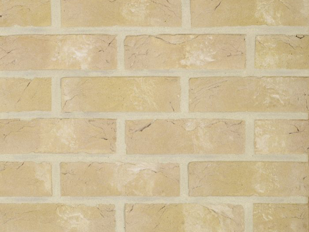 Close up of a wall of Oakington Buff bricks