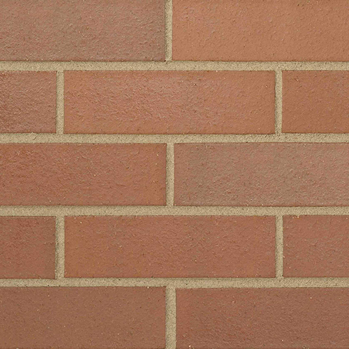Close up of a wall of Hadley Red Smooth 73mm bricks