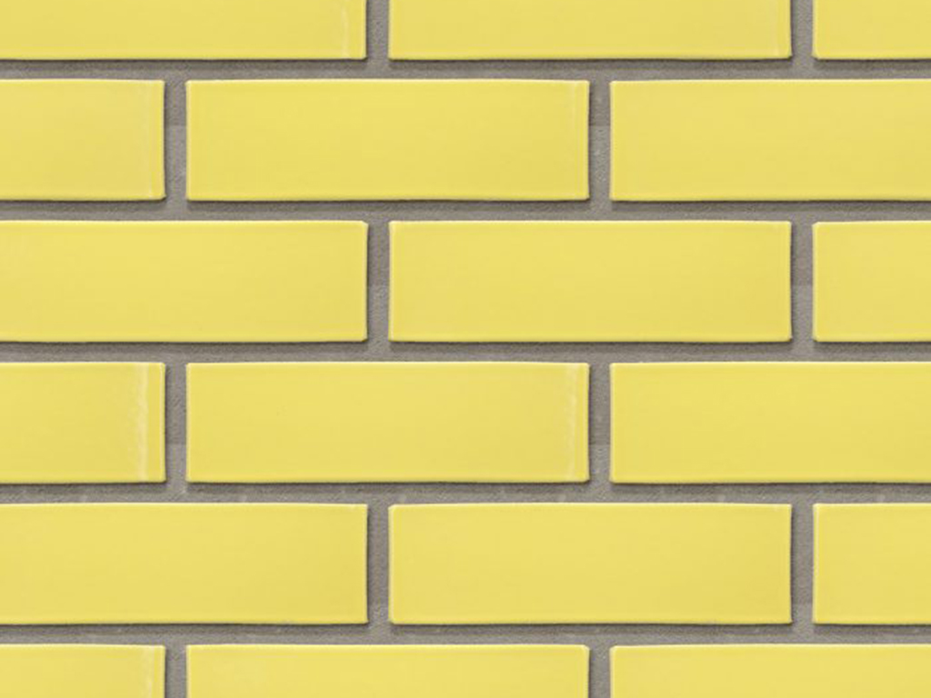 CLose up of a wall of Lisbon Yellow Glazed bricks
