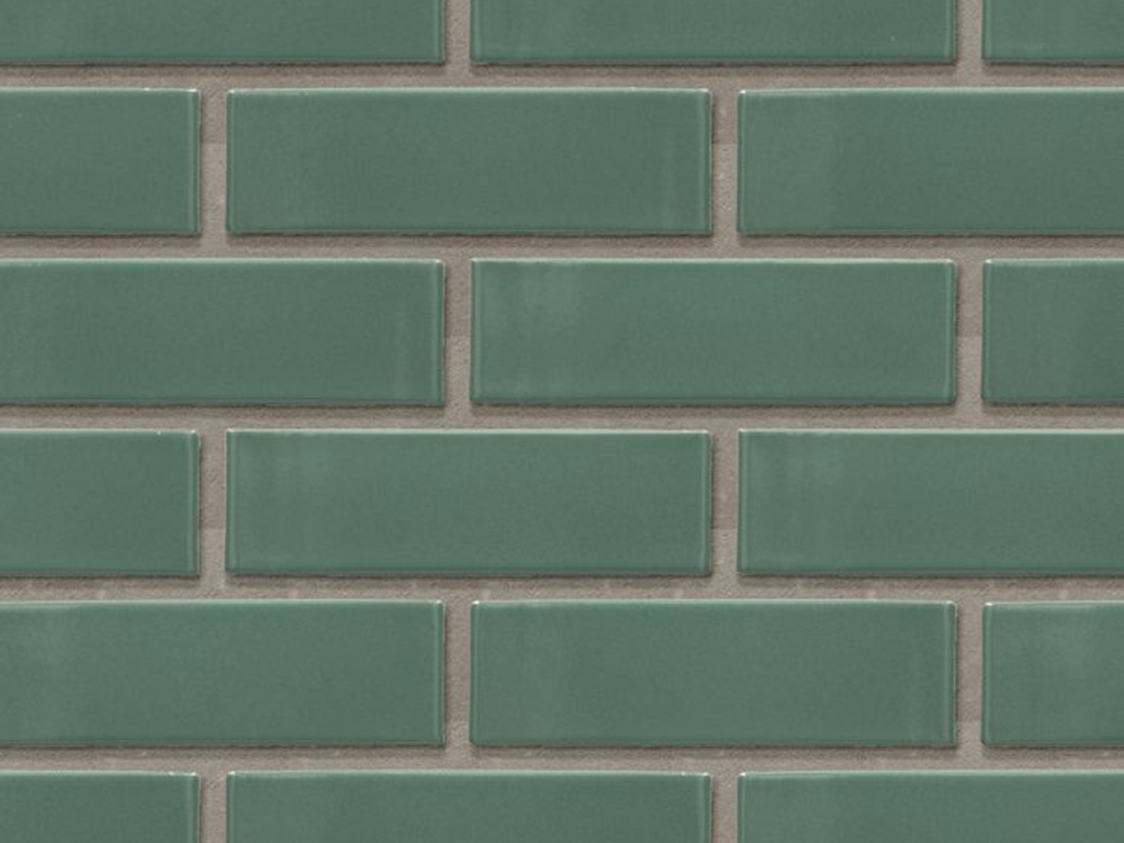 Close up of a wall of Amsterdam Green Glazed bricks