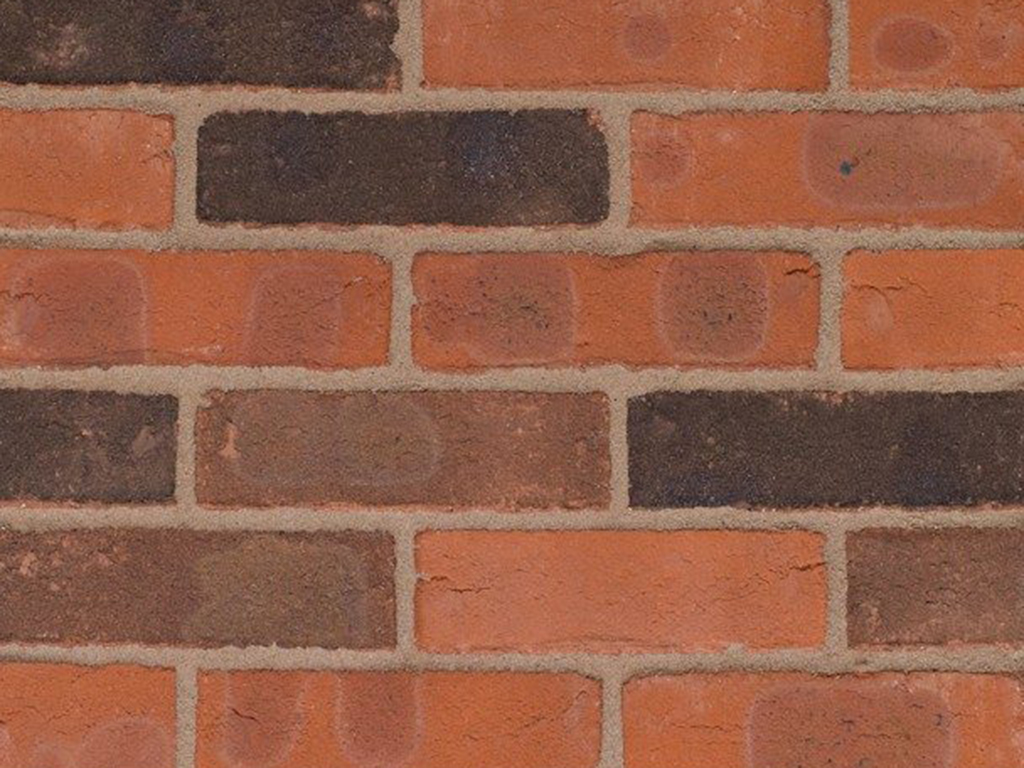 Close up of a wall of Westerton Orange Multi bricks