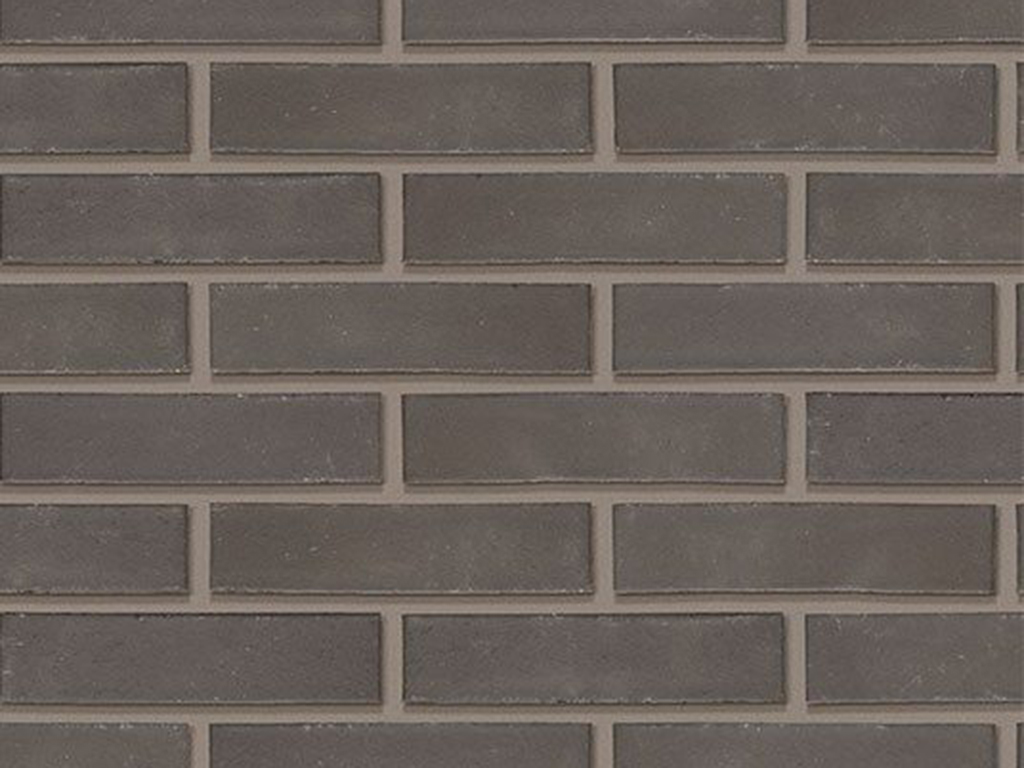 CLose up of a wall of Avenue Smooth Black bricks