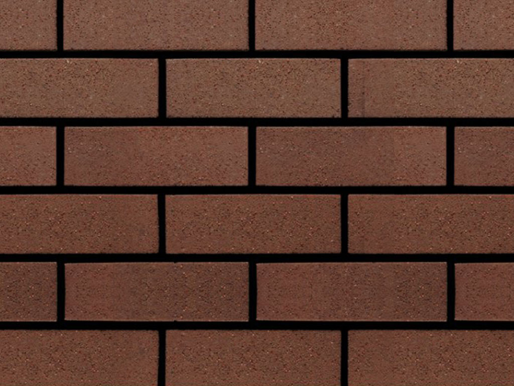 Close up of a wall of Border Brown Sandfaced bricks