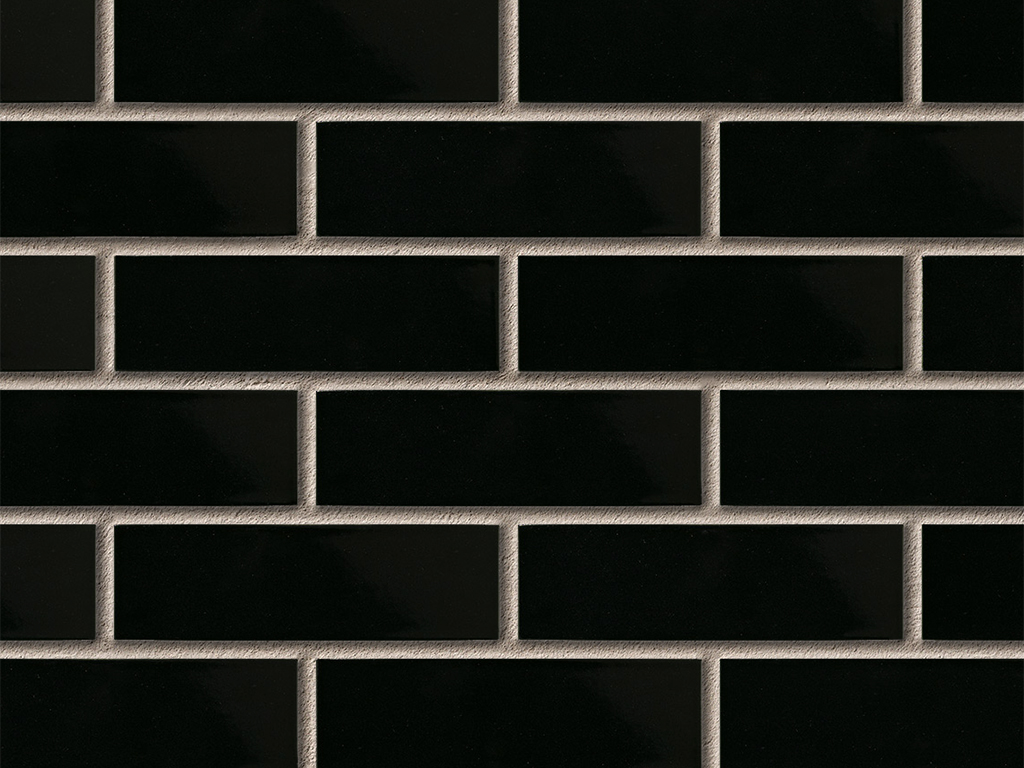 Close up of a wal of Black Glazed bricks