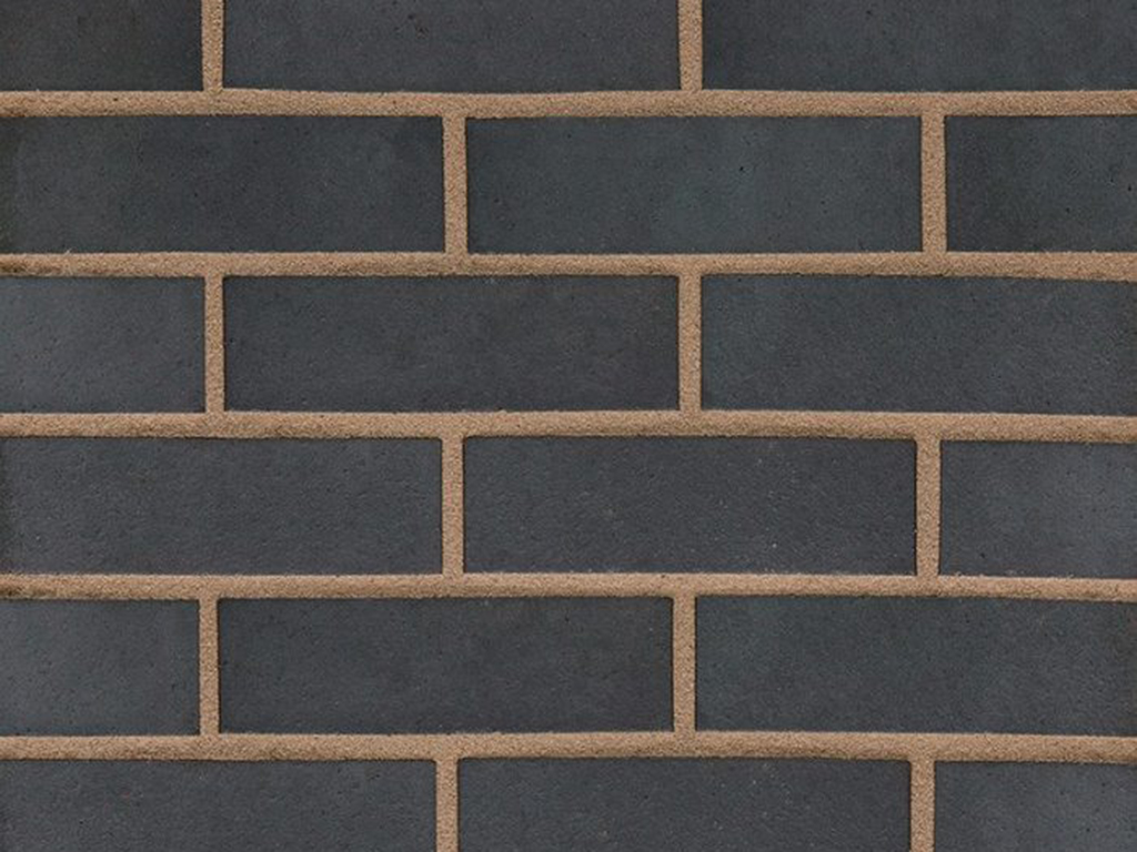 Close up of a wall of Staffordshire Smooth Blue Perforated bricks