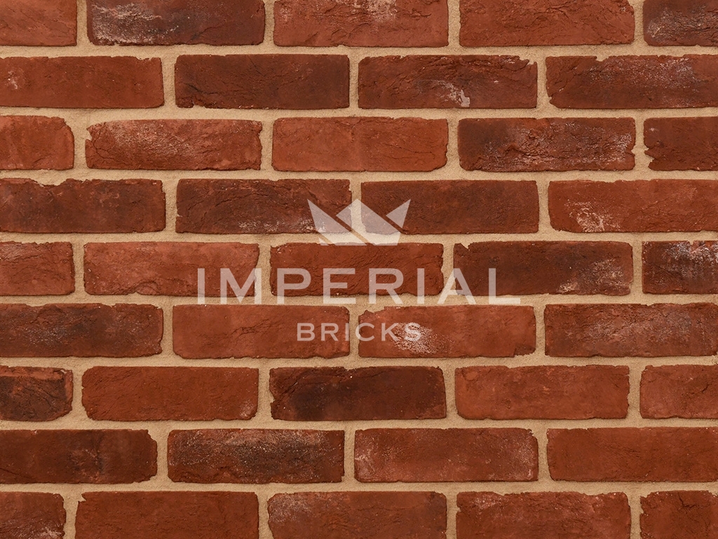 Close up of a wall of Reclamation Red Handmade bricks