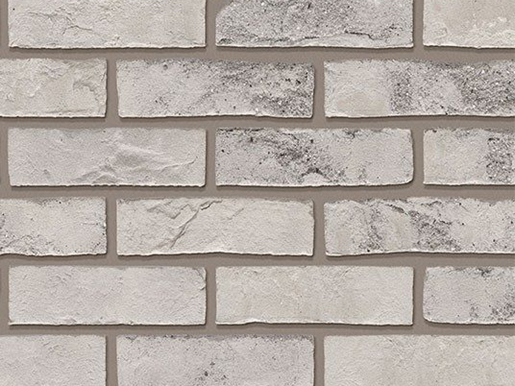 A wall of Forum Smoked Branco bricks