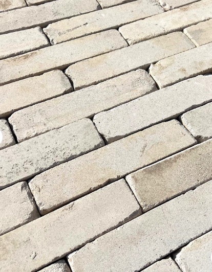 Diagonal panel view of white linear bricks