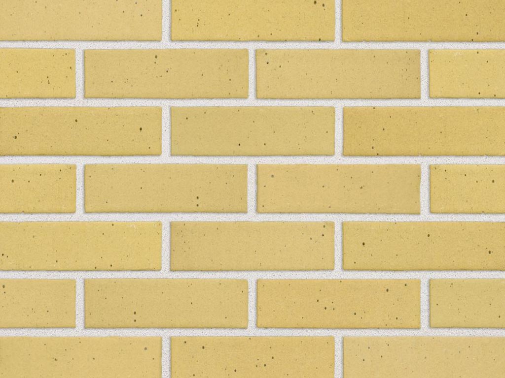 Close up of a wall of Yellow Smooth bricks