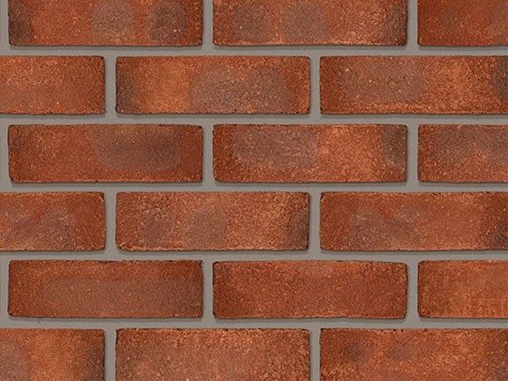 Close up of a wall of Durham Claret Stock bricks
