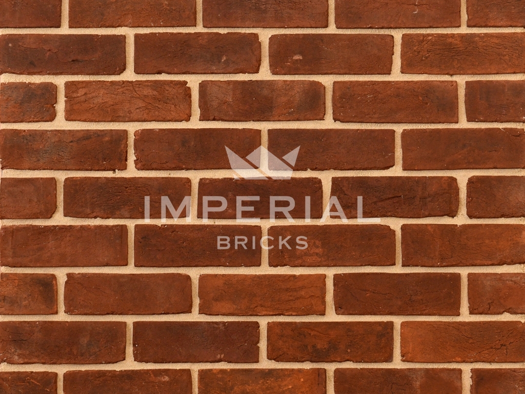 Close up of a wall of Weathered Red Handmade bricks